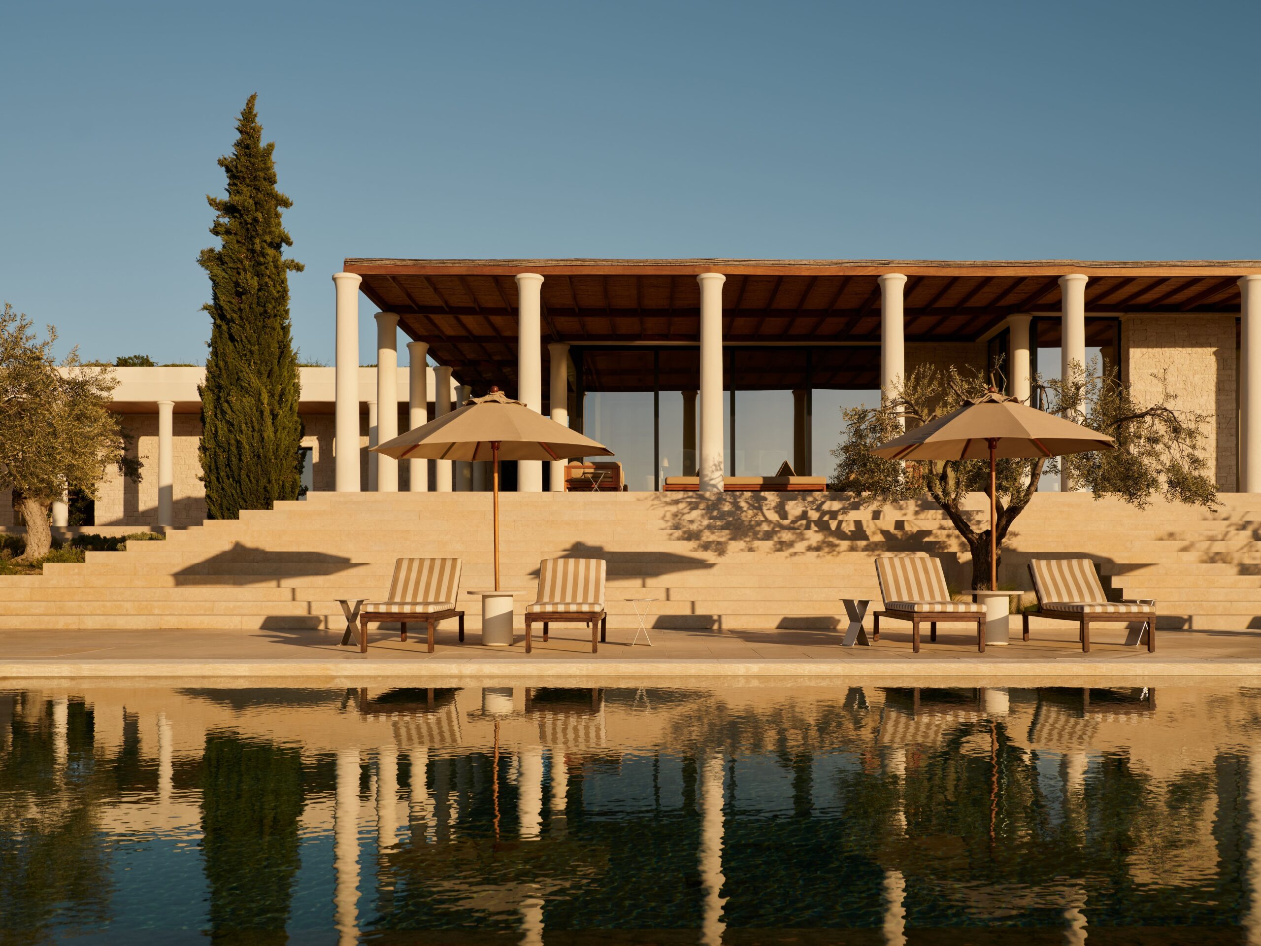 Amanzoe, Greece - Accommodation, Villas, Villa 3, Pool Exterior view of a private villa at Maslina Resort, featuring modern architecture, floor-to-ceiling windows, a private pool, and views of the Adriatic Sea.